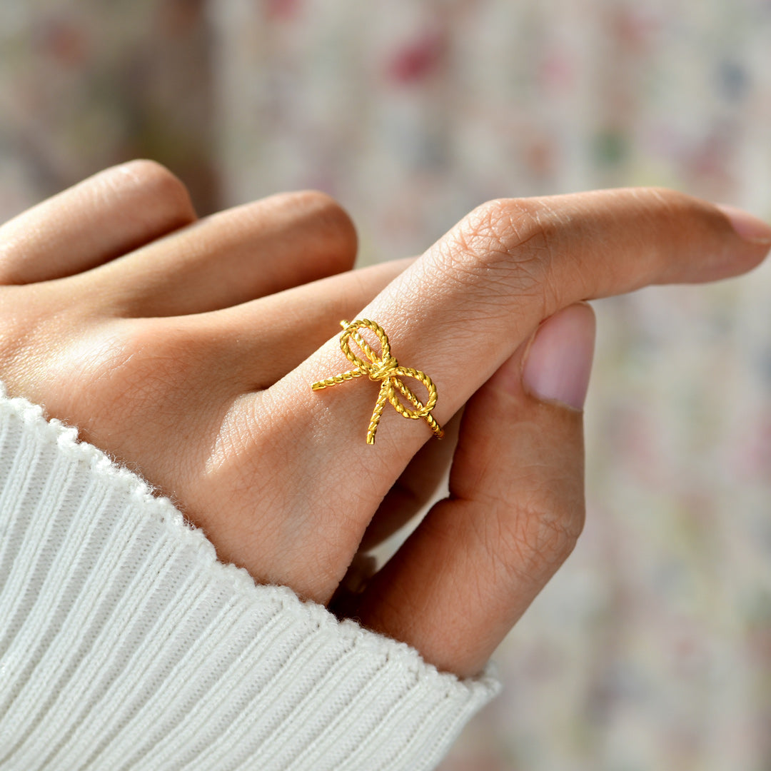 Sealed with Angel's Kiss Golden Ribbon Ring